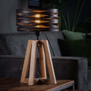 Die KAWOLA Tischlampe DALIAN ist ein trendiges Highlight für Ihr Zuhause. Mit ihrem gedrehten Metallschirm und dem gekreuzten Holzrahmen kombiniert diese Leuchte stilvolle Materialien auf innovativ...